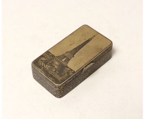A late 19th century Russian 84 zolotnik and niello rectangular snuff box, the cover decorated with the Eiffel Tower, assay ma