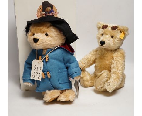 A Steiff Paddington 26cm box and certificate together with a yellow tag Steiff Paddington does not have his suitcase