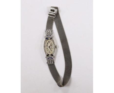 A mid 20th century white metal, sapphire and diamond cluster set Invicta Manufacturing Co. manual wind cocktail watch, on an 