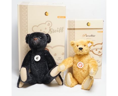 A blond Steiff somersaulting Teddy bear and a Steiff replica 1908 black Teddy bear, each boxed with certificateTwo teds in th