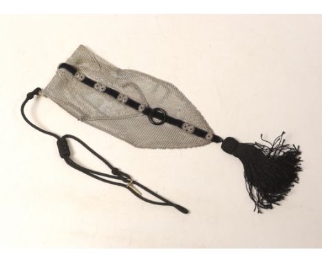 A 1920's silver mesh and black sash with tassel mounted evening bag, with black suspension cord, import marks for Cohen &amp;