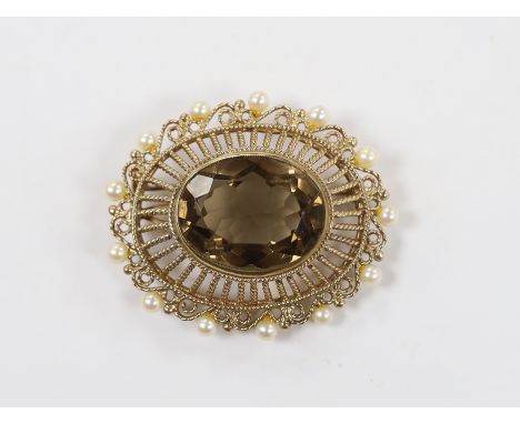 A Zeeta 9ct and oval cut yellowy brown quartz set pendant brooch, with cultured pearl set border, 46mm, gross weight 17.2 gra