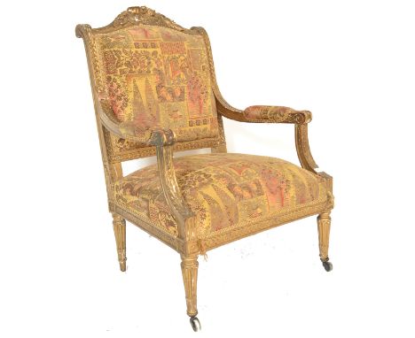 A 19th century French Gilt Wood Fauteuil armchair. Gilded tapering legs with ceramic castors having an overstuffed seat and b