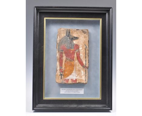 Ancient Egypt - A sarcophagus fragment painted with a depiction of Anubis, the God of the dead, dating from the New Kingdom c