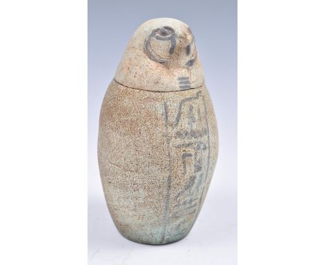 An Ancient Egyptian faience hollow canopic jar having blue colouration with black hieroglyphics, the jar names Duamutef, the 