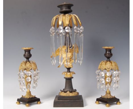 An early 19th century William IV 3 piece lustre garniture - candelabra. The large central stick with gilt eagle surrounded by