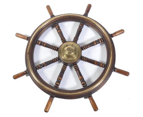 A rare nautical interest 19th Century oak and brass ships wheel having notation to the center in brass reading City Of Worces