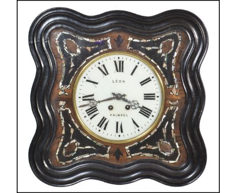 A French 19th century ebonised ' Leon Paimpol ' bullseye clock having enamel dial with mother of pearl insets and faceted han