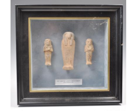 Ancient Egypt - A collection of three Egyptian Ushabti funeral statuettes to include two small faience figures with painted h