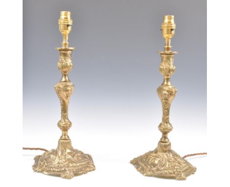 A pair of 19th century French brass relief worked candles having been beautifully converted to table lamps. Each lamp with sh