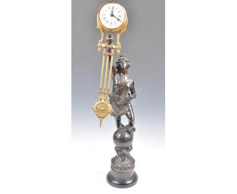 An early 20th Century French antique mystery clock in the manner of Junghans depicting a classical maiden in spelter mounted 