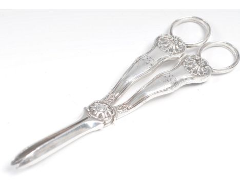 An early 19th Century Georgian Paul Storr for Joseph Rodgers pair of silver plated grape scissors having ring hoop handles wi