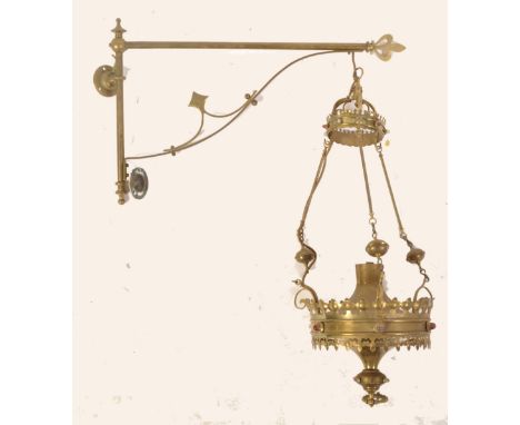 A 19th Century Gothic brass wall light with original bracket having Gothic pierced fretwork and coloured glass cabochons. Mea