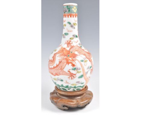 A 19th Century Chinese vase of baluster form decorated in Wucai polychrome enamel decoration depicting raging dragon in ocher