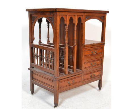 A 19th century Victorian solid oak&nbsp; Canterbury stand having a bank of drawers with 3 spindle gallery section magazine st