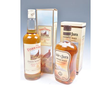 A bottle of single malt Isle of Jura Scotch Whisky 10 years old complete in the original box&nbsp;dated 1990&nbsp; together w