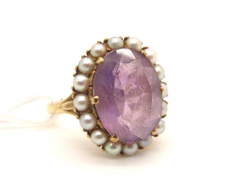 A Large 9ct Gold Amethyst and Pearl Oval Cluster Ring, claw set (finger size S).