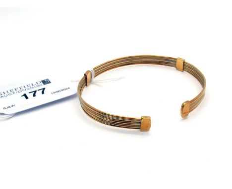 A Modern Two Colour Bangle, stamped "750" "264 AR".13.8 grams 