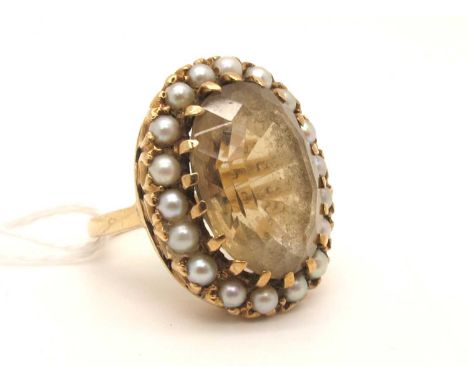 A Large 9ct Gold Citrine and Pearl Oval Cluster Ring, claw set (finger size M).Currently appears cloudy due to wear and use, 