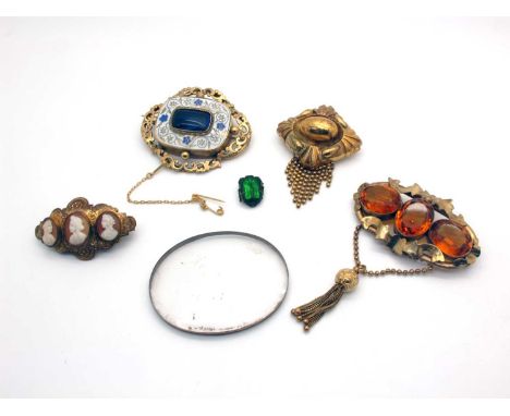 A Large Decorative Victorian Brooch, the deep central cushion shape panel highlighted in blue and white enamel, with central 