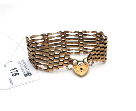A 9ct Gold Gate Link Style Bracelet, to 9ct gold heart shape padlock style clasp (13grams).