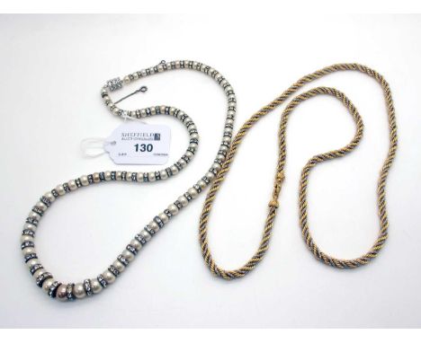 Christian Dior; A Two Tone Ropetwist Chain Necklace, clasp stamped "Chr.Dior ©"; An Imitation Pearl Graduated Single Strand N