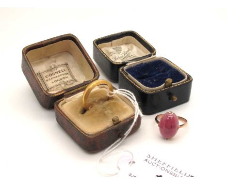 An Antique Garnet Cabochon Single Stone Ring, oval claw set, stamped "9ct" (finger size L); A 22ct Gold Wedding Band, (finger