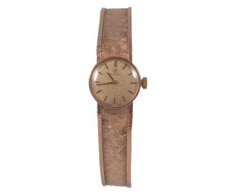 Omega – a lady’s 9 carat yellow gold manual wind bracelet wristwatch, 15mm circular champagne dial with raised batons in a 17