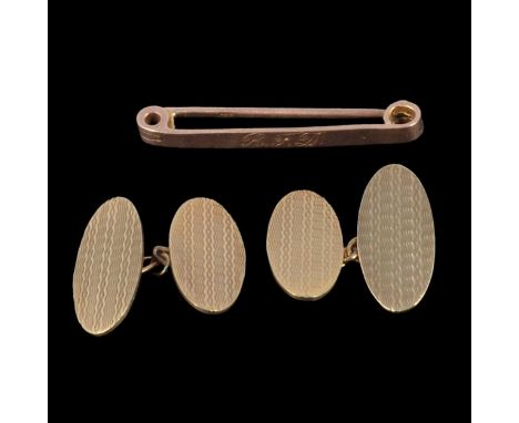 A pair of 9 carat yellow gold cufflinks and tie bar, a pair of 9 carat yellow gold cufflinks, engine turned oval faces, engra