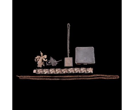 A silver powder compact, jewellery, and base metal guard chain, a silver powder compact, engine turned with scroll border, en
