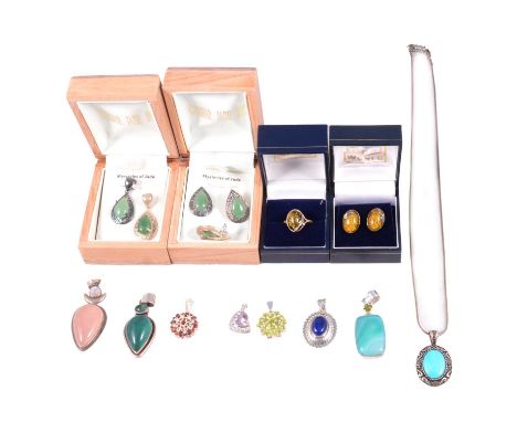 White metal gemset pendants, earrings and chains, a ruby in zoisite pendant, the pear shape stone suspended within a pear sha
