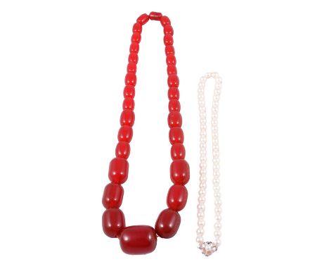 A cultured pearl necklace and a cherry amber coloured bead necklace, a cultured pearl necklace, fifty-two 7.7mm uniform pearl