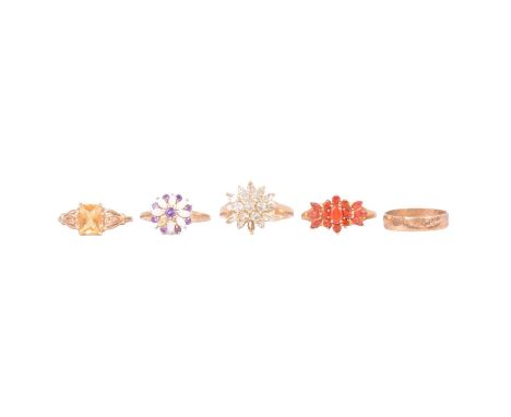 Five 9 carat yellow gold rings, some gemset, a citrine dress ring, the rectangular princess cut stone claw set in a 9 carat y