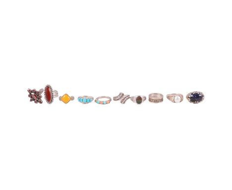 Twenty-five silver and white metal rings, some gemset, some unworn, a yellow and white metal band, the central white metal sw