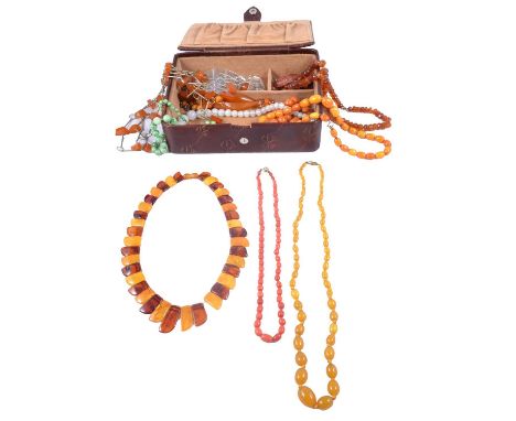 Amber coloured and other gemstone and plastic bead necklaces, white and blue enamel necklace, a butterscotch amber coloured b