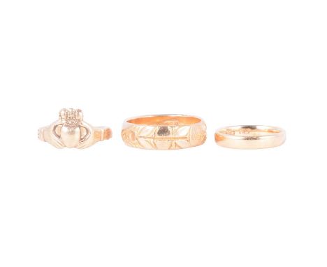Two gold wedding rings and a Cladagh ring, a yellow metal wedding band marked 18ct, 6mm wide D shape with pattern to front, r