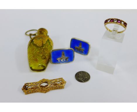 Mixed lot to include a 9 carat gold dress ring, gold plated brooch, enamel cufflinks, three pence coin and a coloured glass s