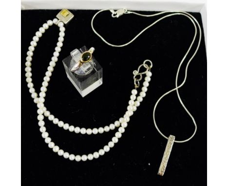 A collection of contemporary silver jewellery designed by Annie Smith to include a dress ring, pearl necklace and a silver ch