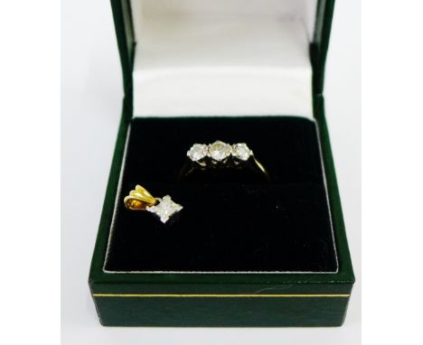 18 carat gold three stone diamond ring together with an 18 carat gold and diamond set pendant (2) 