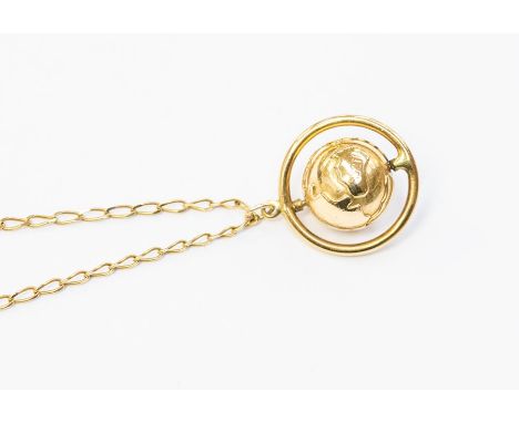 A world planet pendant on a 9ct gold chain, the world within a rotating border, diameter approx. 22mm, chain length approx. 2