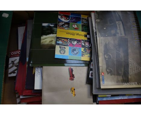 A quantity of assorted sales brochures including Corgi; EFE; Maisto; Sun Star and others. (one box)