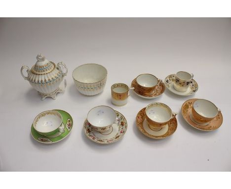 A collection of early 19th Century Derby tea wares,ed comprising Derby Bloor floral pattern cup and saucer on a green ground,