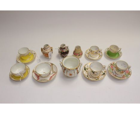 A collection of 19th Century Crown Derby, by Stevenson and Hancock, comprising coffee cans and saucers, of various designs wi