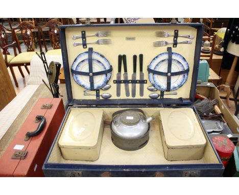 Two vintage cased picnic sets, one in navy leatherette case and retailed by Bentalls, the other in red case by Brexton with c