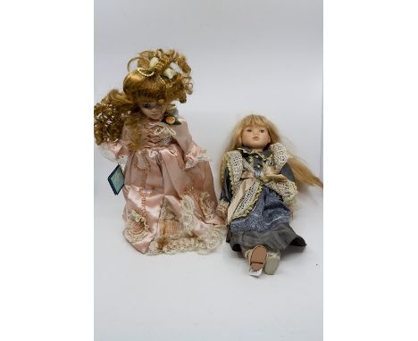 A collection of modern bisque headed dolls in period costume, A pair of wooden bagatelle boards to include Corinthian 21T