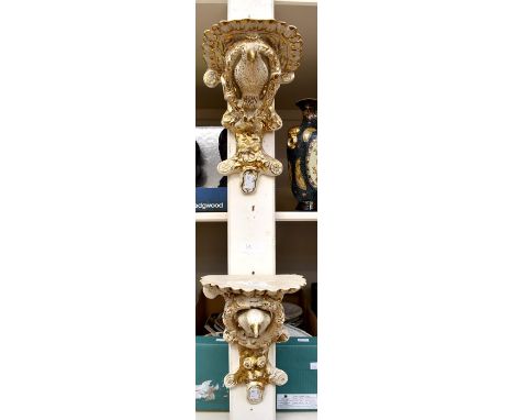 A pair of Continental ceramic wall stands, birds in tree design