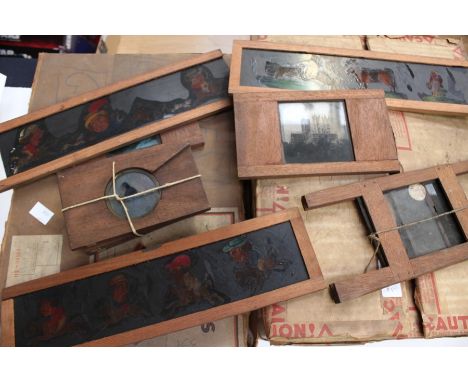Two boxes of glass magic lantern slides, some painted, one box packed up in 1938!