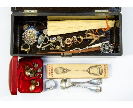 A white metal fork with mother of pearl handle; a collection of brooches, rings, spoons, forks etc all within a Japanese lacq