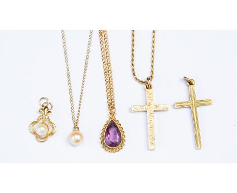 Two 9ct gold crucifix, combined weight approx. 6.3gms&nbsp;along with an amethyst&nbsp;pear shaped pendant on an unmarked yel
