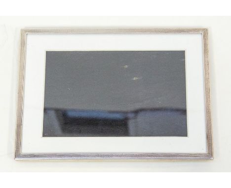 A silver photo frame with engine turned decoration, wood back, 20m x 15cm, Birmingham 1934